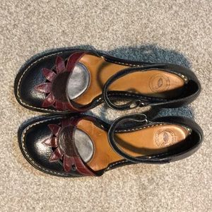 Nurture black leather clogs, size 10.